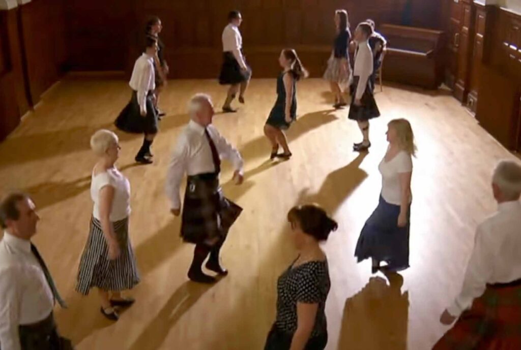 People doing Scottish country dancing performing The Dashing White Sergeant as part of a learn the steps with Robbie Shepherd video from YouTube